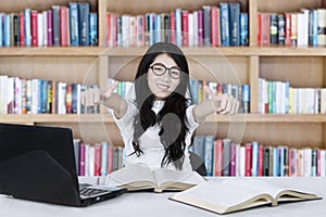 Asian female student with OK gesture