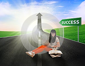 Asian female student study on road of success