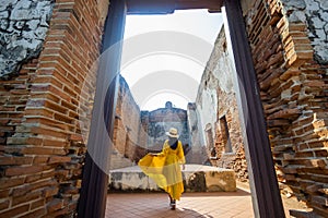 Asian female tourists travel to the ancient Buddhist temples of Thailand