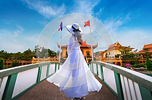 Asian female tourists wearing a white dress visit Lung Ho`s house in Nakhon Phanom province,Thailand