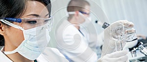 Asian Female Woman Scientist Working in a Medical Research Lab or Laboratory Panoramic Web Banner