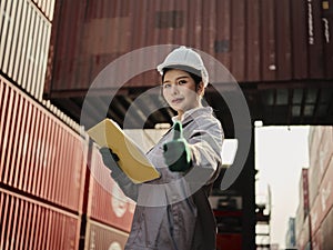 Asian female worker showing thumb as thank you or approval