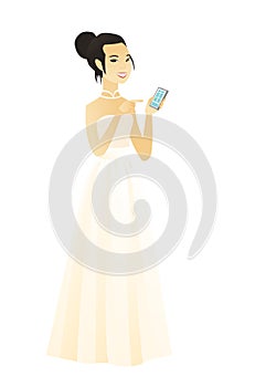 Asian fiancee holding a mobile phone.