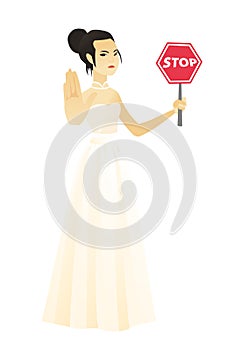 Asian fiancee holding stop road sign.