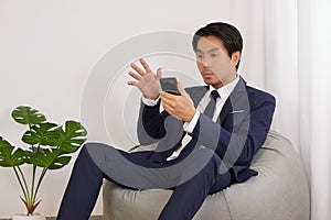 Asian Financial Advisor Video Conference via Smartphone