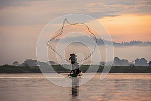 Asian fishermen set sail for fishing on the Mekong River