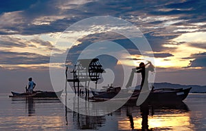 Asian fishermen with sunset.