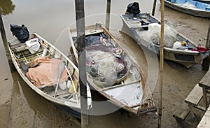 Asian fishing boat that stuck during a low tide