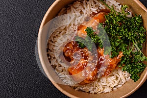 Asian food boiled rice with meat with sweet and sour sauce, spices and herbs photo