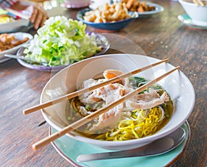 Asian food with chop stcks on set table