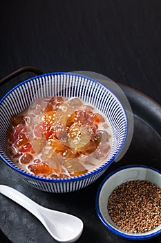 Asian Food  concept Krong Krang Dessert Sweet topical gnocchi in coconut milk in ceramic cup on rustic iron tray with copy space