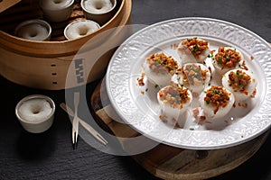 Asian food concept spot focus Chwee Kueh Strem savory rice cake on black background with copy space photo