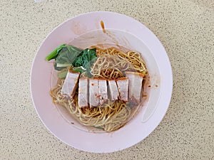 Asian food : Egg noodle with roast pork belly