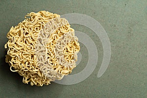 Asian food instant noodle on green wood table