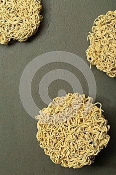 Asian food instant noodle on green wood table