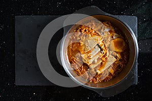 Asian food, Kimchi Jjigae soup. Top view with copy space photo