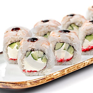 asian food - sushi roll with shrimp, cucumber and masago caviar.