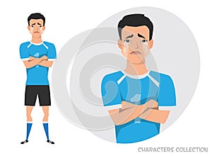 Asian football player crossed his arms and cries. Mans tears and depression. The emotion of disappointment and sadness