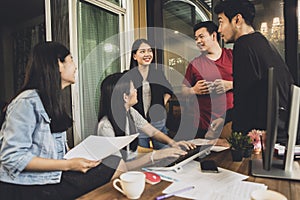 Asian freelance team talking with relaxing in home office