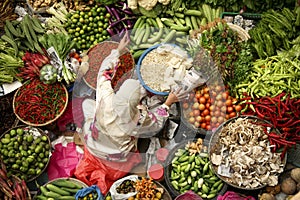 asian woman working fresh fruit and vegetable market photo