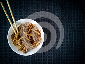 Asian fried noodles with soy sauce and eggs in a bowl.