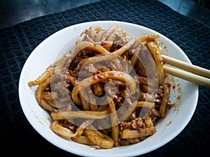 Asian fried noodles with soy sauce and eggs in a bowl.