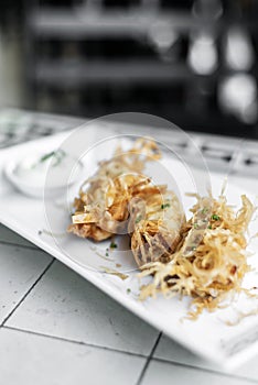 Asian fried rice noodle shrimp spring rolls starter on plate