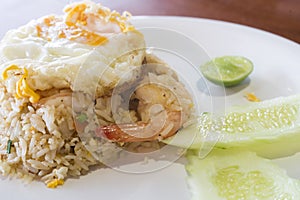 Asian fried rice with prawns vegetables and fried egg