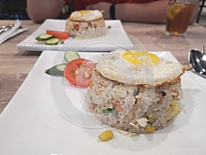 Asian fried rice with vegetables and sunny side up egg