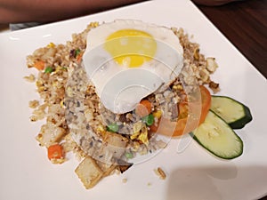 Asian fried rice with vegetables and sunny side up egg