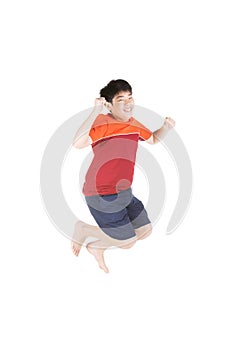 Asian funny child boy jumping on white background