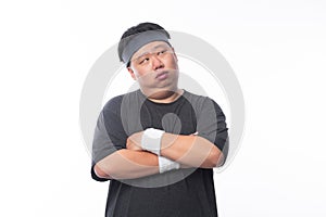 Asian Funny Fat Man in sport outfits arm crossed and looking to copyspace isolated on white background.