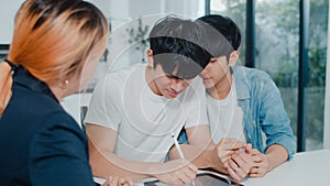 Asian Gay lgbtq men couple sign contract on tablet at home, Young couple consulting with real estate financial advisor, Buying new