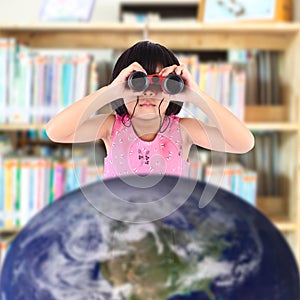 Asian girl with binoculars out of space, photo