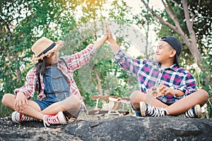 Asian girl and boy playing in nature , Relax time on holiday concept travel
