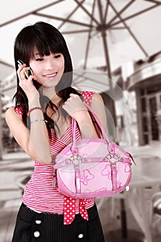 Asian girl on cell phone. photo