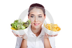 Asian girl choose salad over crisps