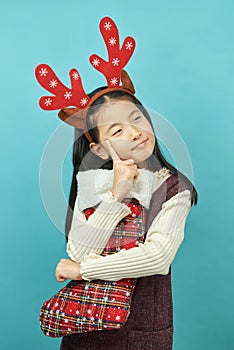 Asian girl with a Christmas concept headdress Child