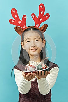 Asian girl with a Christmas concept headdress Child