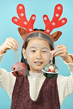 Asian girl with a Christmas concept headdress Child