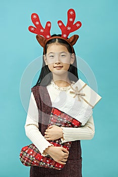 Asian girl with a Christmas concept headdress Child