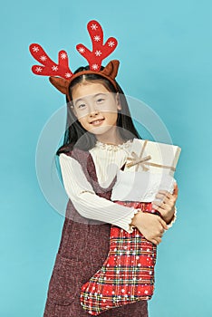 Asian girl with a Christmas concept headdress Child