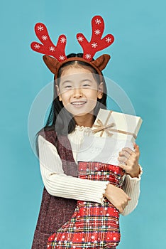 Asian girl with a Christmas concept headdress Child