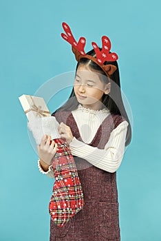 Asian girl with a Christmas concept headdress Child