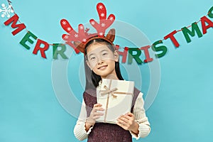 Asian girl with a Christmas concept headdress Child