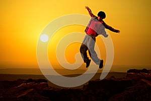 Asian girl dancing in sunrise