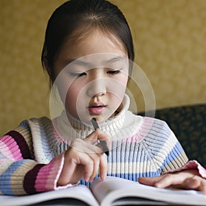 Asian girl doing homework