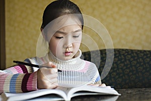 Asian girl doing homework