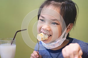 Asian girl eating in chinese restuarant photo
