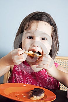 Asian girl eating a donut with milk